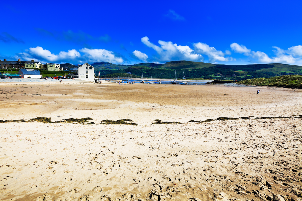 beach with white sand against clear sky backdrop