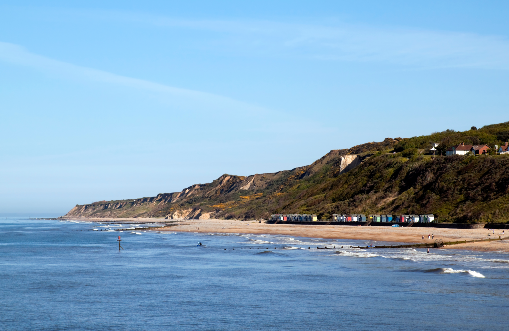 Beach holiday destination with views across the ocean and verdant cliffs