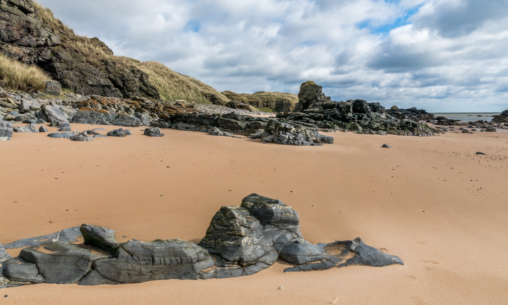 Golden sand and rocks on a beach